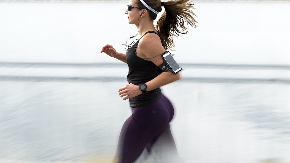 Active Listening in Action: Woman Running with Armband