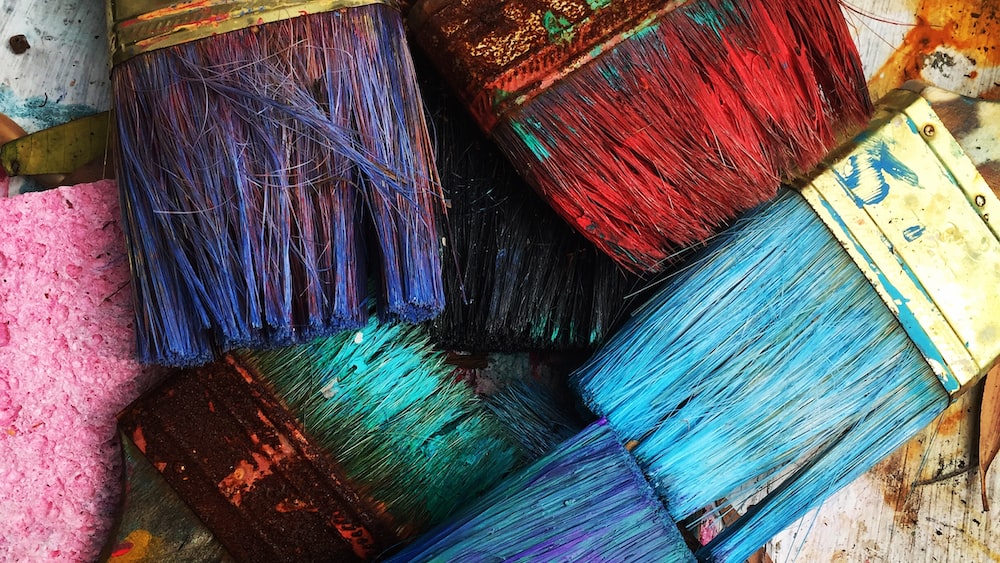 Assorted colorful paintbrushes for mindful art creation.