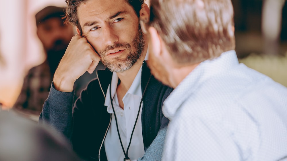 Attentive Listening: Men Engaged in Conversation