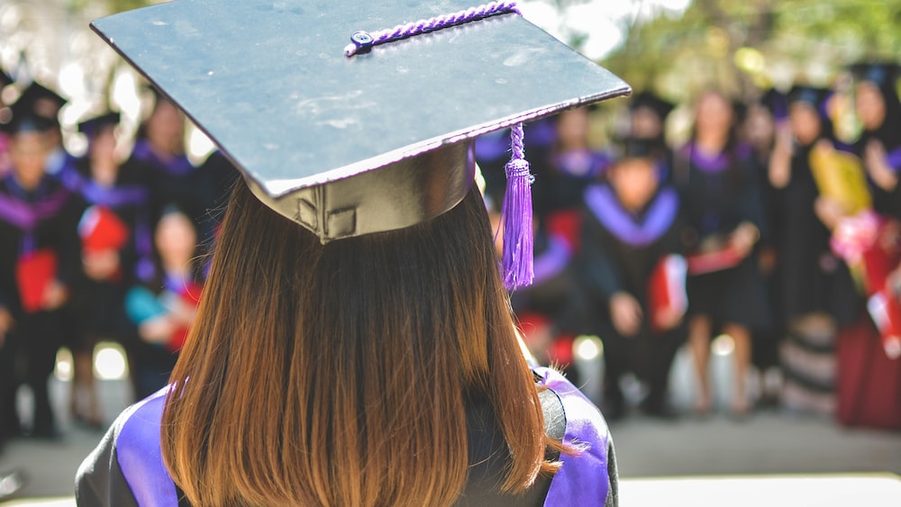 Education: Graduation - Woman in Academic Cap and Dress