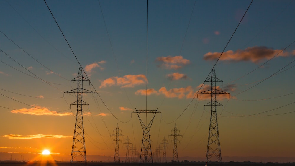 Efficient Energy Transmission: Power Pylons at Sunset