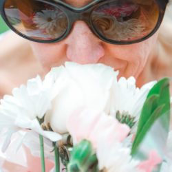 Embracing the Moment Woman Stopping to Smell the Flowers
