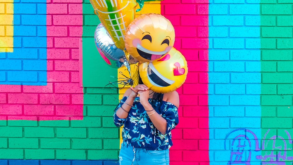Emotional Intelligence: Woman Expressing Joy with Balloons