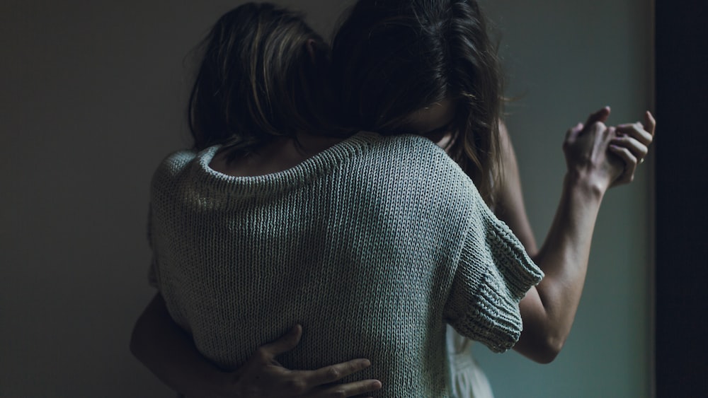 Emotional Maturity Illustrated: Sisters Embracing Goodbye
