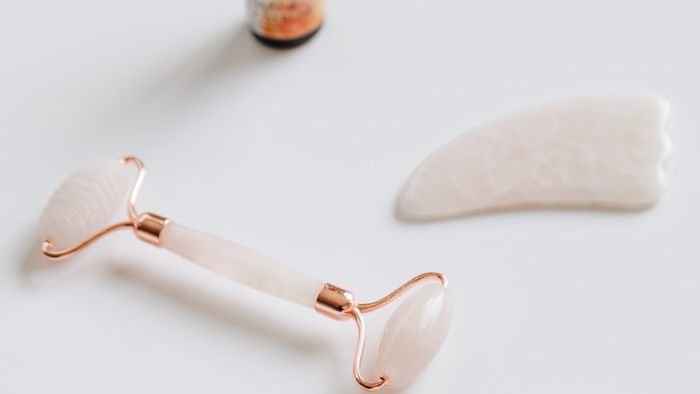 Enhancing Personal Growth with a Rose Quartz Face Roller and Guasha Set