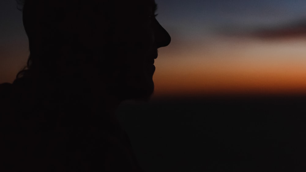 Expressing Feelings: Silhouette of a Person Embracing Emotions during Sunset