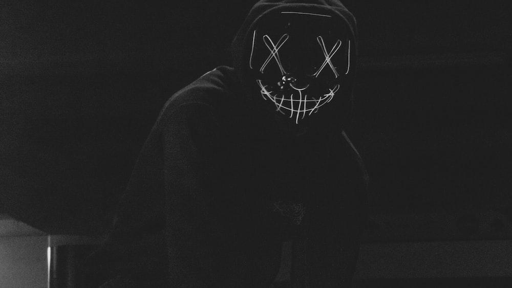 Expressing Grief Through Art: Black and White Masked Person