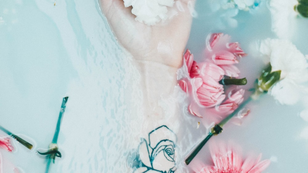 Floral Tattoo Harmony: Self Improvement in a Milk Bath Photoshoot