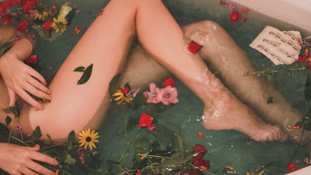Girl relaxing in flower bath: Depicting low self-esteem