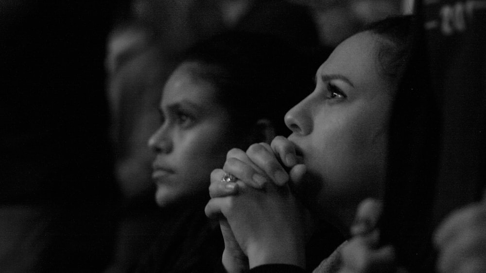 Group of Catholic Women Engaged in Active Listening during Speaker Session