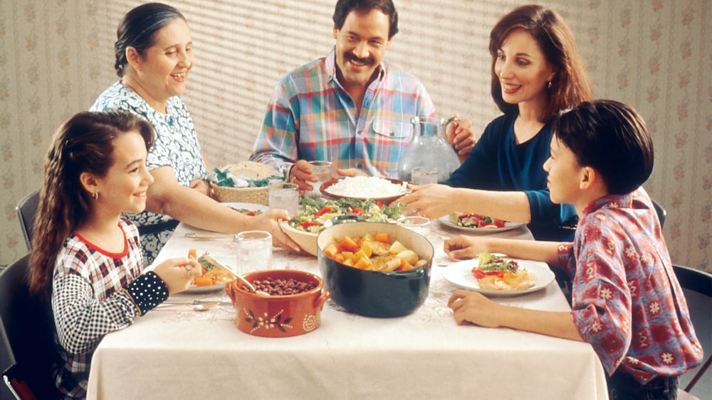 Hispanic family enjoying mindful eating together.