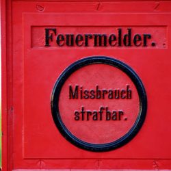Maintaining Integrity and Accountability A German Fire Alarm Box Symbolizing Information Integrity
