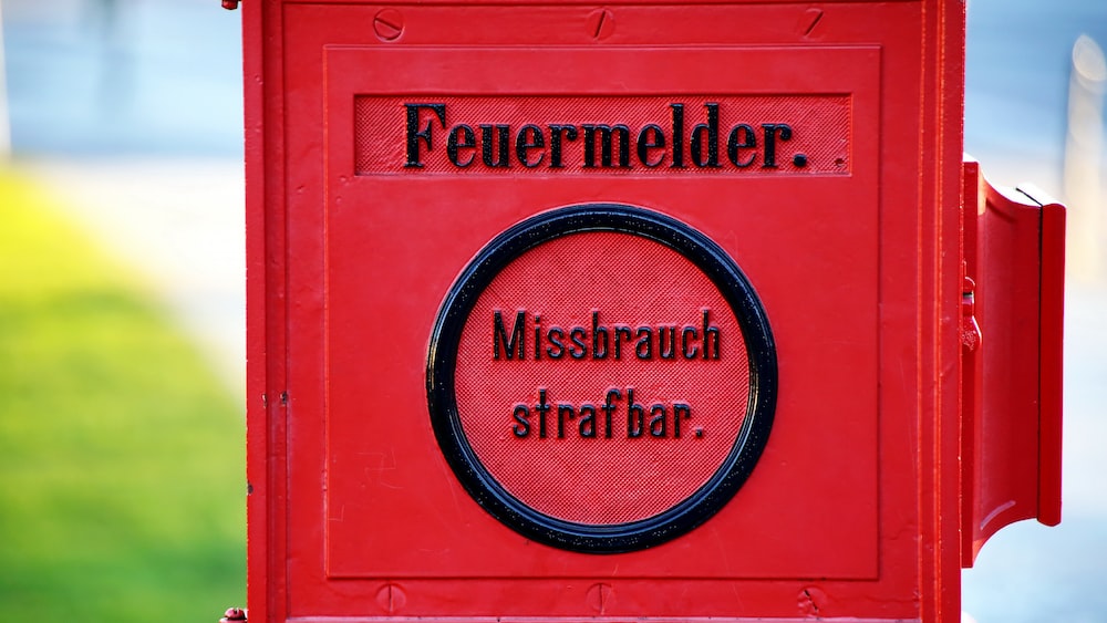 Maintaining Integrity and Accountability A German Fire Alarm Box Symbolizing Information Integrity