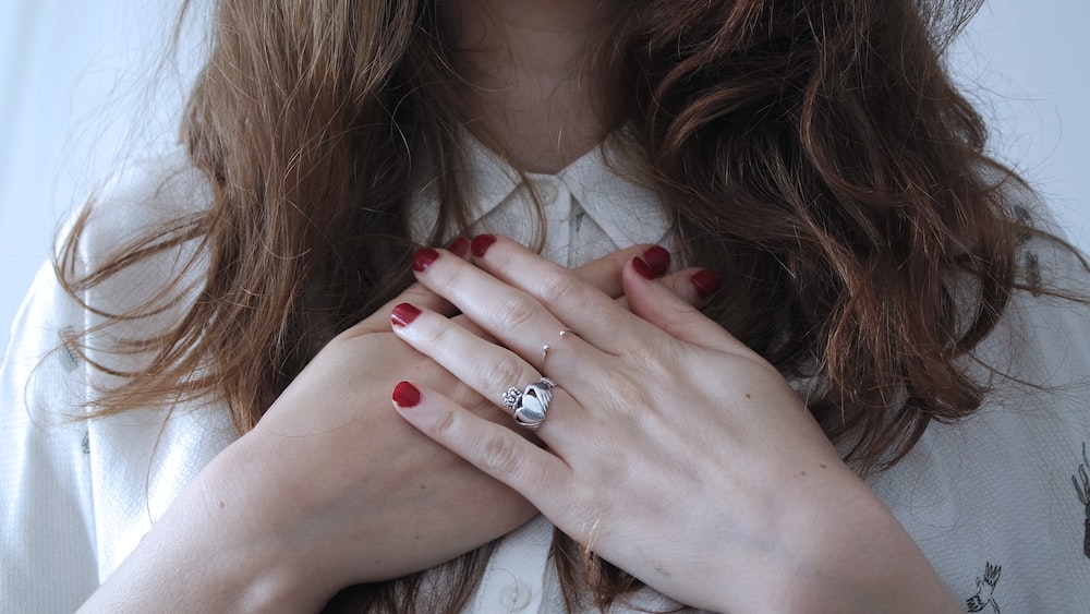 Mastering Self Improvement and Self Growth: Woman with Crossed Hands and Silver-Colored Ring