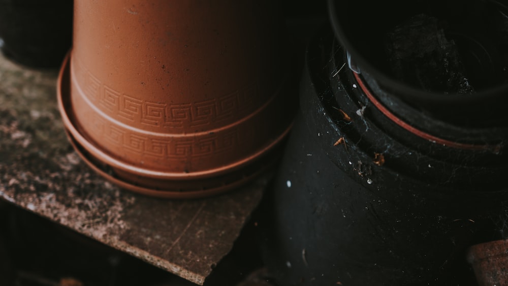 Mindful Gardening: Brown Flower Pots on Wooden Shelf