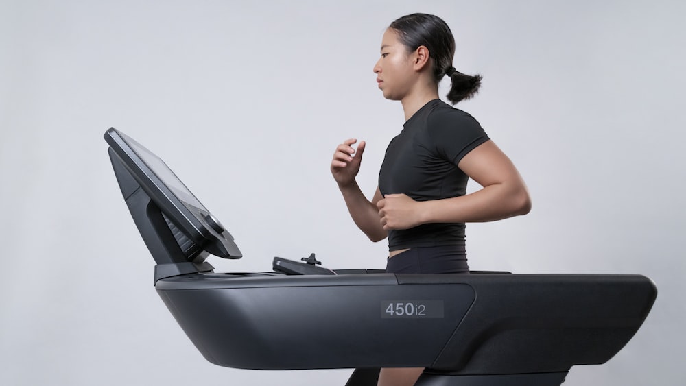 Mindful Running: Fit Woman on Intenza 450 Series Treadmill
