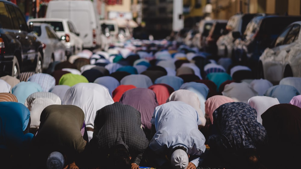 Muslims engaged in self-regulation during Friday prayer in Dubai