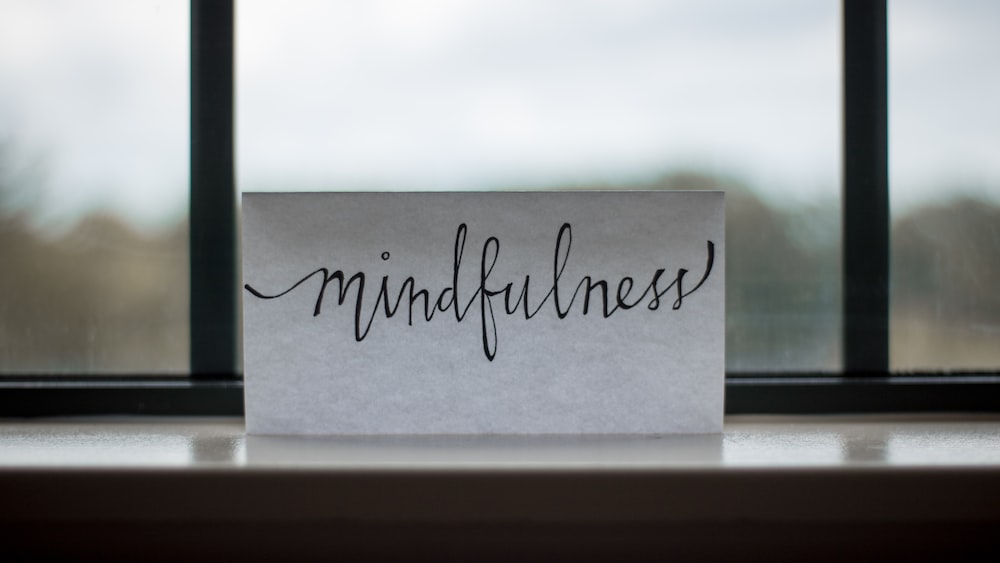 Printed Mindfulness Reminder Near Window.