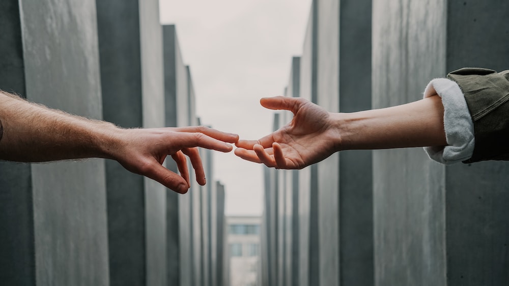 Reconnecting Love and Hate: Depicting Empathy through Hands