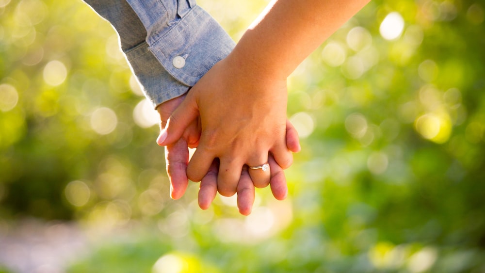 Relationship Management: A Couple Holding Hands on a Trail