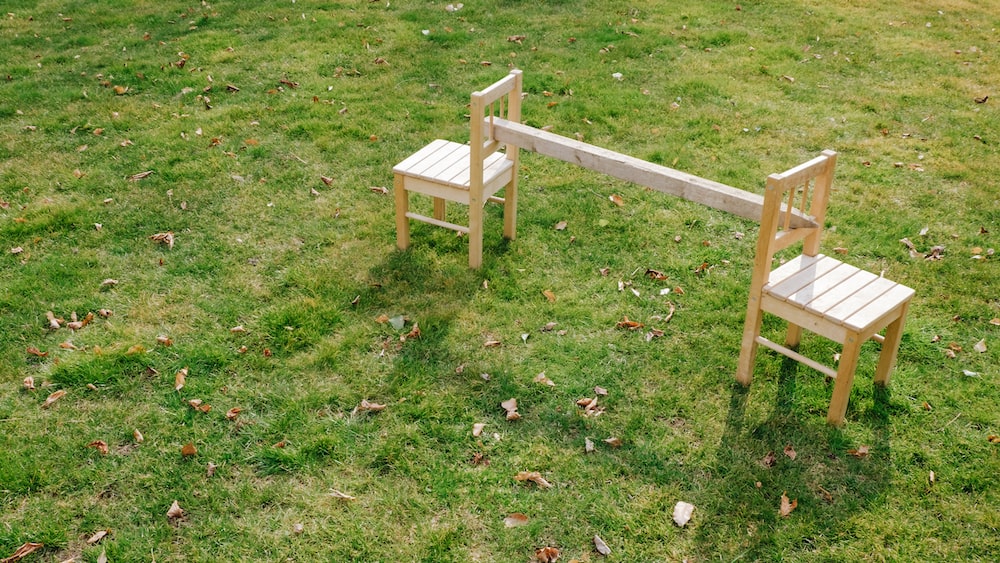 Reliability in Nature: Chairs amidst Lush Green Fields