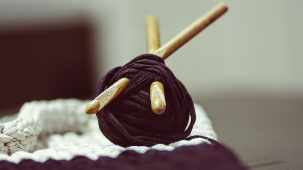 Therapeutic Knitting Essentials: Brown Yarn Roll and Crochet Hooks