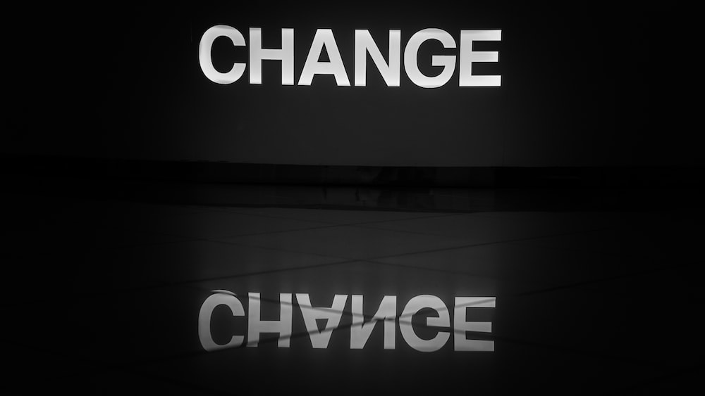 Transformation of Change: Illuminated Word on Tiled Floor