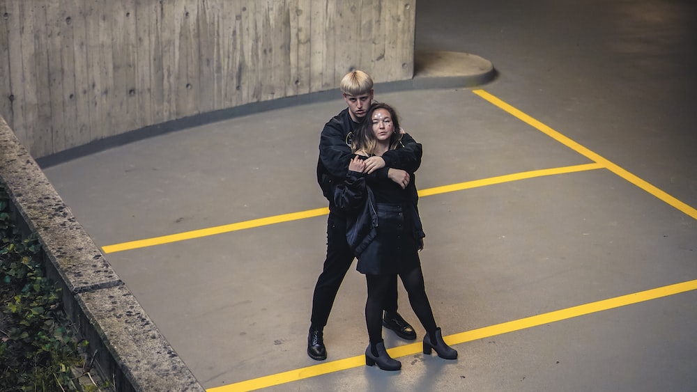 Unveiling Accountability: Strangers Standing Near Concrete Railings